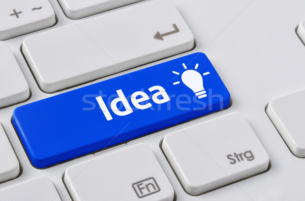 A keyboard with a blue button - Idea Stock photo © Zerbor