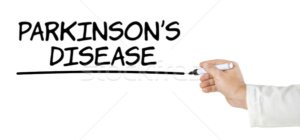 Hand with pen writing Parkinsons Disease Stock photo © Zerbor
