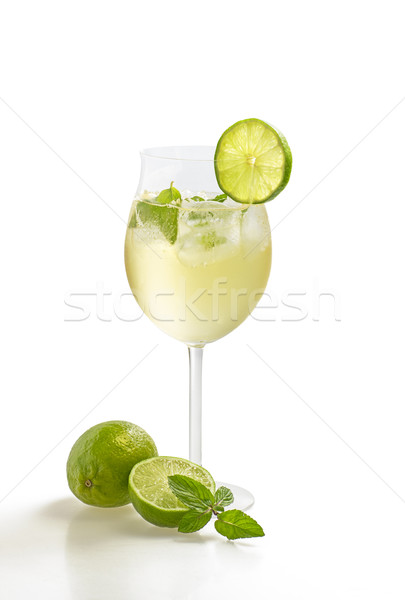 Drink with lime and mint in a wine glass Stock photo © Zerbor