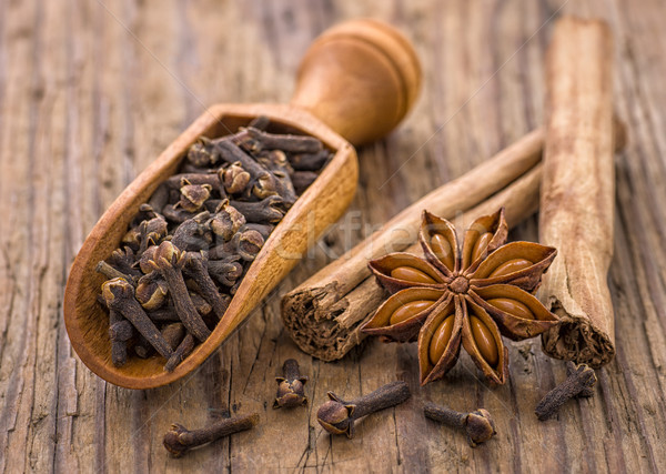 Spice scoop with cloves, star anise and cinnamon sticks Stock photo © Zerbor