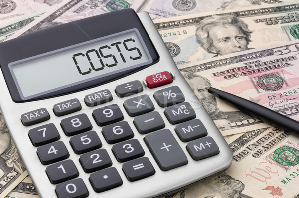 Stock photo: Calculator with money - Costs