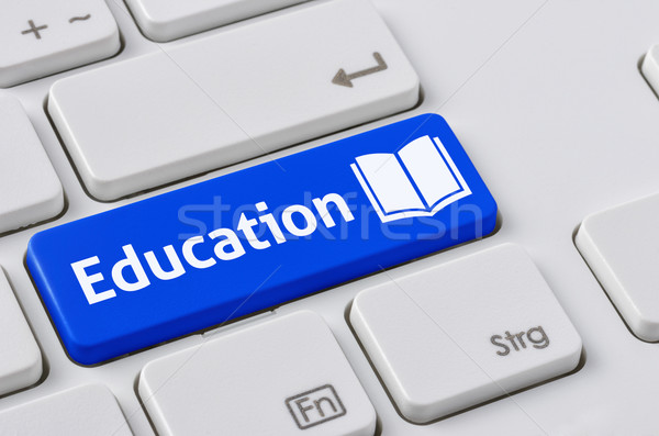 A keyboard with a blue button - Education Stock photo © Zerbor