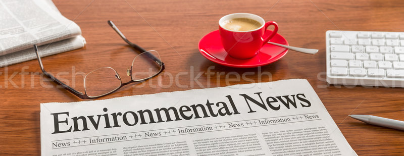 A newspaper on a wooden desk - Environmental News Stock photo © Zerbor
