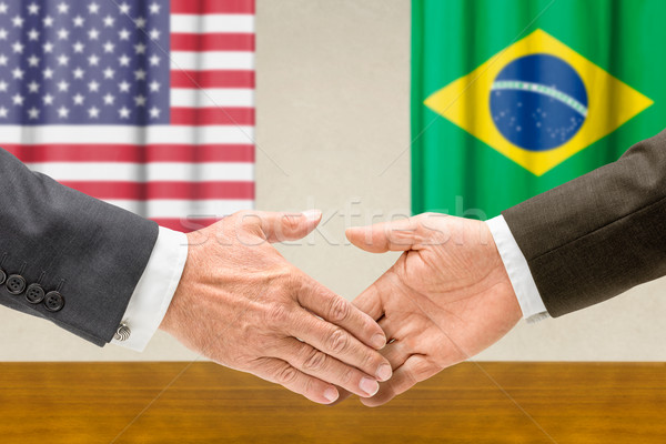 Representatives of the USA and Brazil shake hands Stock photo © Zerbor
