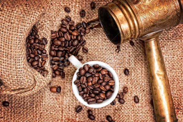Arabic copper turks, cup and  scattered coffee grains Stock photo © Zhukow