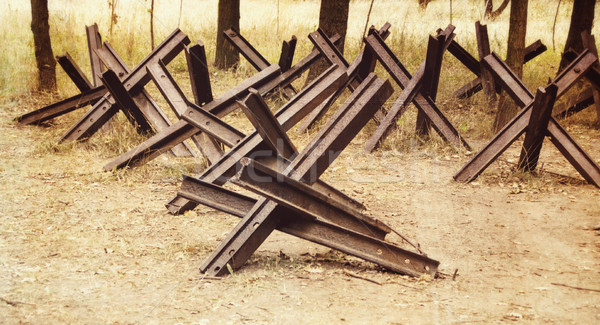 hedgehogs antitank defence, retro colors, paper grain Stock photo © Zhukow