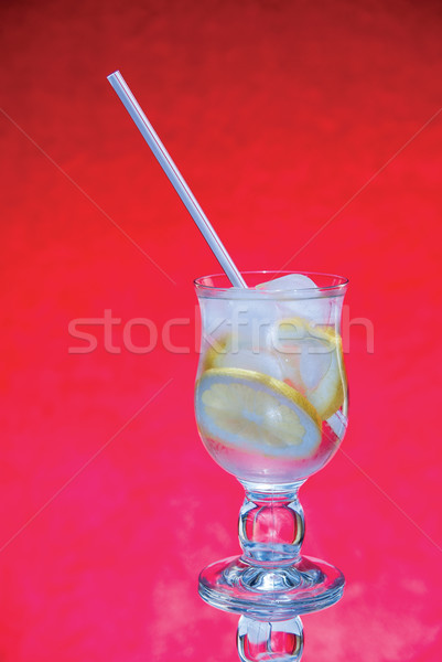 cold fresh lemonade  on  red background Stock photo © Zhukow