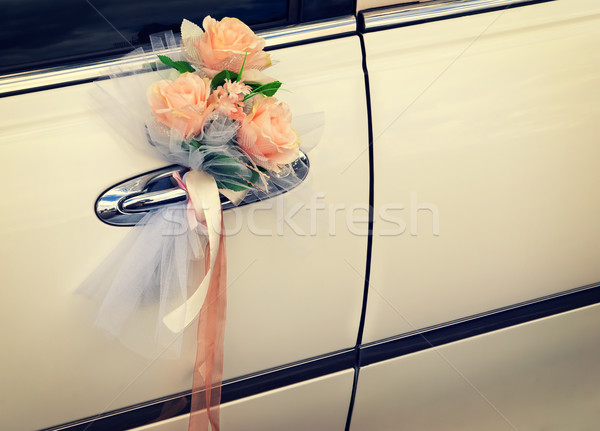 Door of white wedding car with flowers and white bow Stock photo © Zhukow