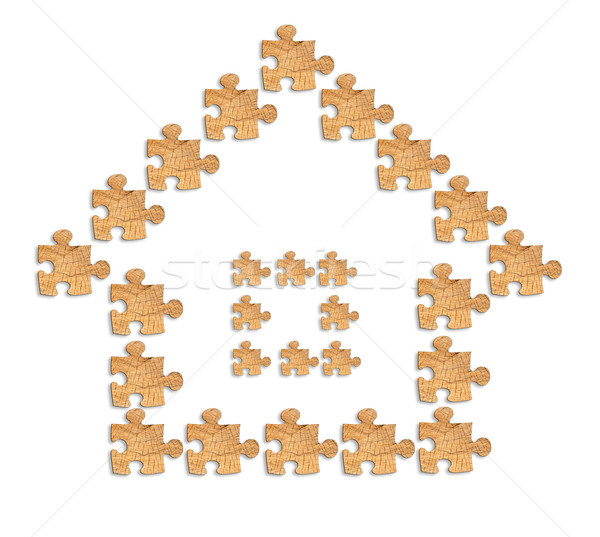 image of a house made of wooden figures puzzles Stock photo © Zhukow