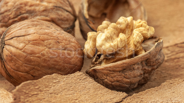 Walnuts on old wooden background,  paper texture Stock photo © Zhukow