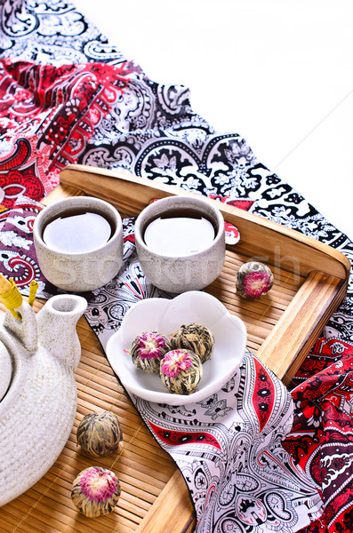 Green tea in the form of a ball with a red flower Stock photo © zia_shusha