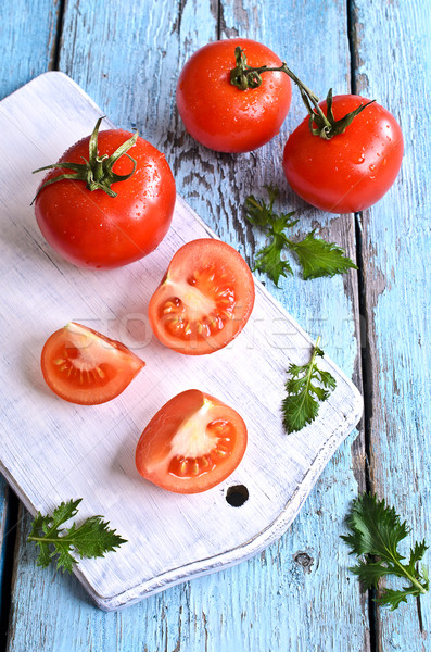 Tomatoes and green lettuce Stock photo © zia_shusha