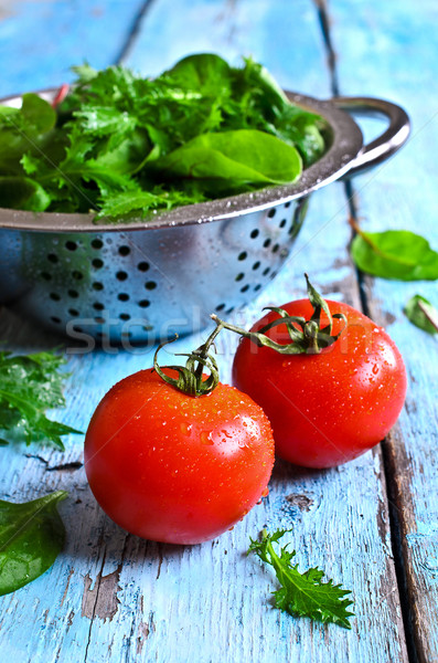 Tomatoes and green lettuce Stock photo © zia_shusha