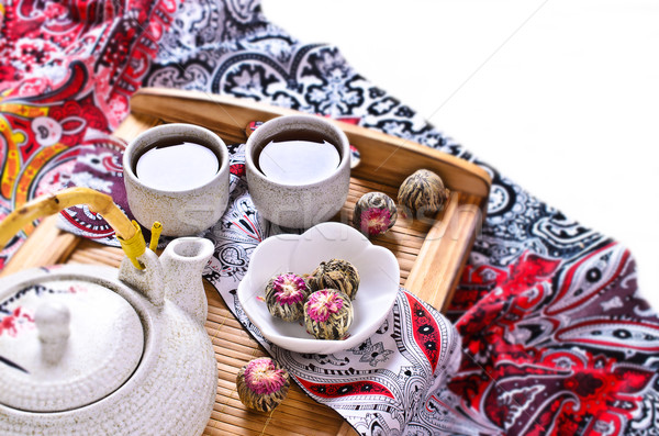 Green tea in the form of a ball with a red flower Stock photo © zia_shusha