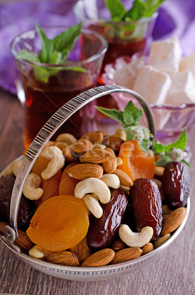 almonds, dried apricots, cashews, dates, lying in a metal bowl  Stock photo © zia_shusha