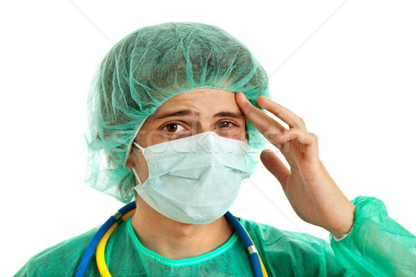 Kopfschmerzen jungen männlich Krankenschwester isoliert weiß Stock foto © zittto
