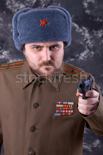 Rosyjski młody człowiek wojskowych studio pistolet portret Zdjęcia stock © zittto