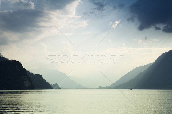 Tó hegyek Svájc víz nap természet Stock fotó © zittto