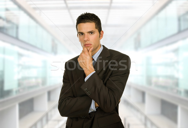 Pensive jeunes homme d'affaires pense bureau affaires [[stock_photo]] © zittto