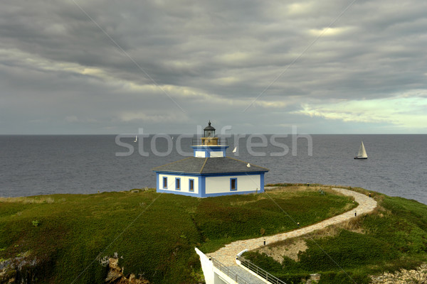 Deniz feneri küçük sahil kuzey İspanya bulutlar Stok fotoğraf © zittto