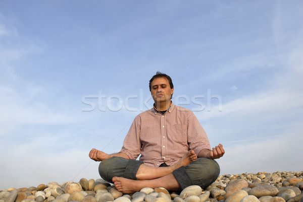 Méditation jeune homme plage sourire travaux mer [[stock_photo]] © zittto