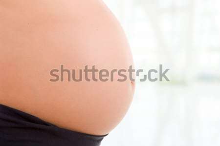 Incinta primo piano donna incinta bianco corpo home Foto d'archivio © zittto