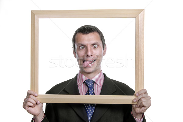 Głupi młodych człowiek biznesu portret wewnątrz ramki Zdjęcia stock © zittto