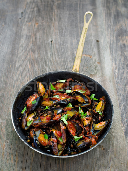 rustic black mussel in tomato sauce Stock photo © zkruger