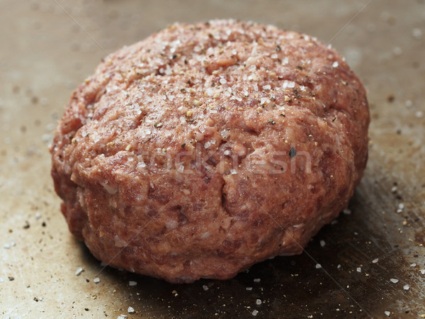 rustic uncooked seasoned hamburger patty Stock photo © zkruger