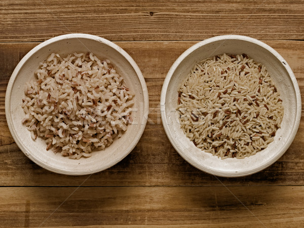 rustic cooked and uncooked unpolished brown rice Stock photo © zkruger