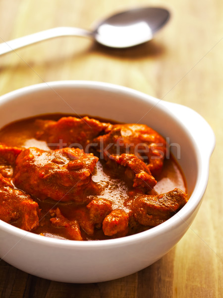 Indio carne de cordero curry tazón rojo Foto stock © zkruger