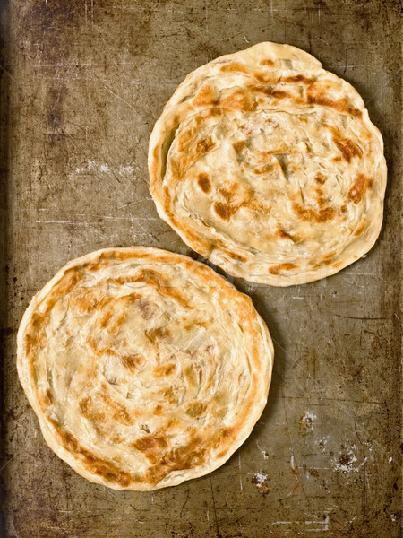 rustic indian roti prata Stock photo © zkruger