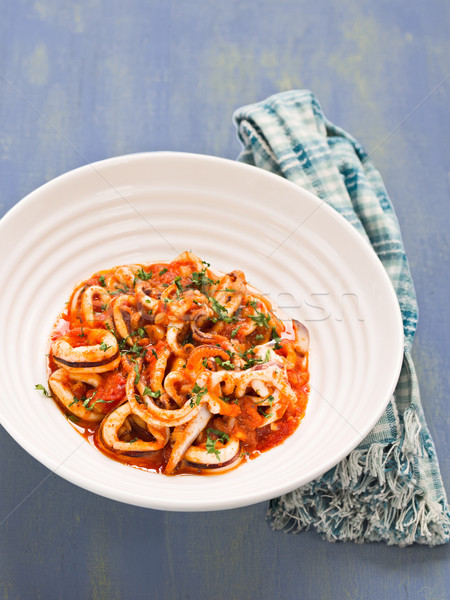 rustic italian calamari in spicy tomato sauce Stock photo © zkruger