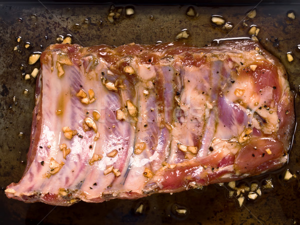 Rack rustikal marinierten Schweinefleisch Rippe Stock foto © zkruger