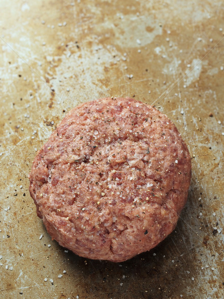 rustic uncooked seasoned hamburger patty Stock photo © zkruger