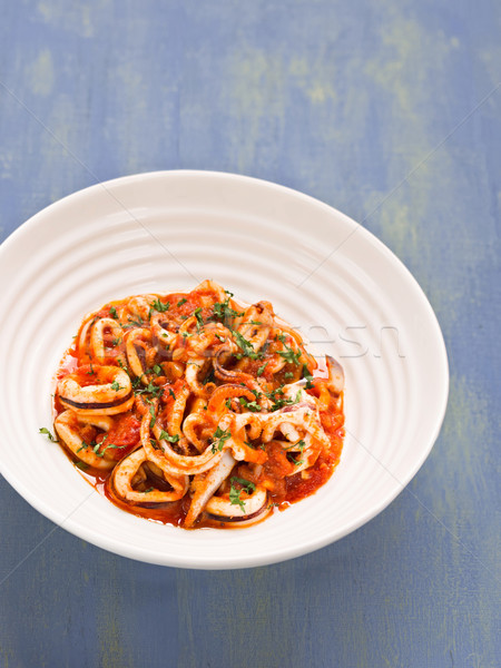 rustic italian calamari in spicy tomato sauce Stock photo © zkruger