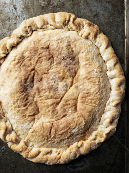 Stock photo: rustic italian calzone stuffed pizza