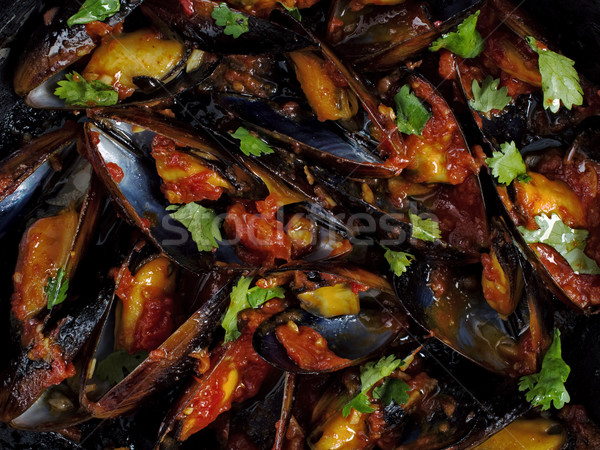 black mussel in tomato sauce food background Stock photo © zkruger