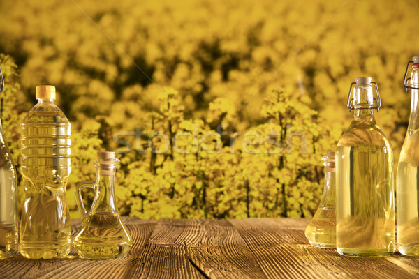Olie plantaardige flessen glas tabel bloem Stockfoto © zolnierek