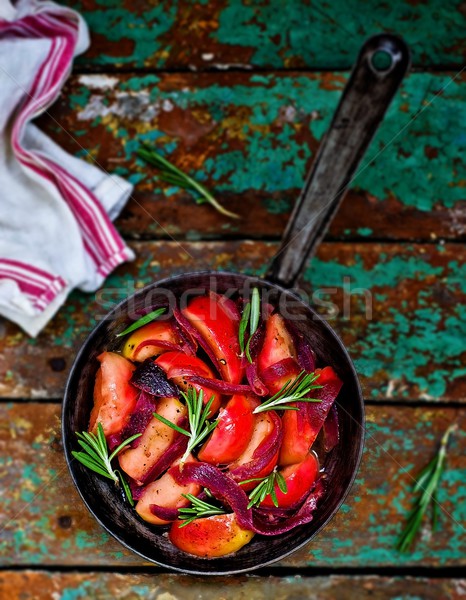 stewed onions and apples with rosemary in a frying pan  Stock photo © zoryanchik
