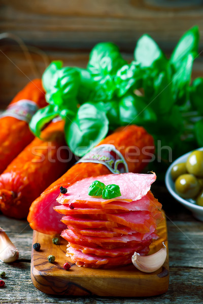 The cut salami sausage on a chopping board Stock photo © zoryanchik