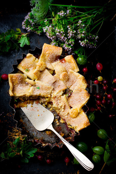 Patchwork  strawberry and gooseberry pie. dark photo Stock photo © zoryanchik