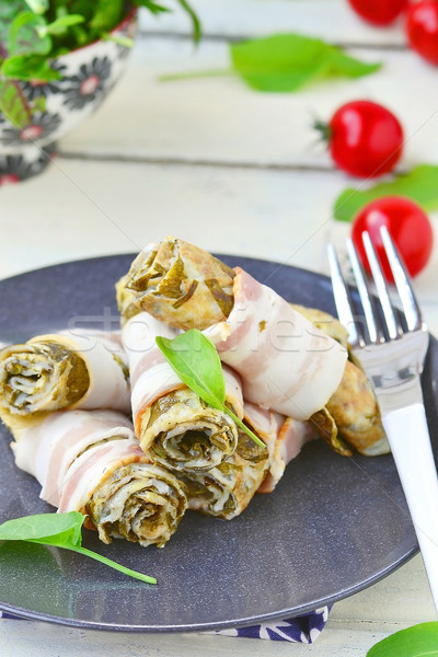 Rolls from an omelet with a sorrel and bacon Stock photo © zoryanchik