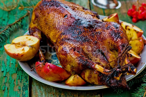 the Christmas baked goose with apples Stock photo © zoryanchik