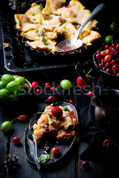 Patchwork  strawberry and gooseberry pie. dark photo Stock photo © zoryanchik