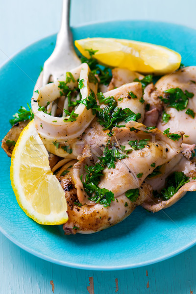 grilled calamary a grill with parsley and a lemon Stock photo © zoryanchik