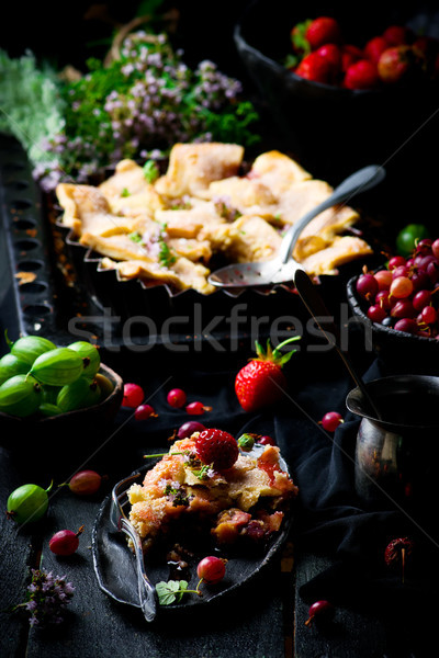 Patchwork  strawberry and gooseberry pie. dark photo Stock photo © zoryanchik