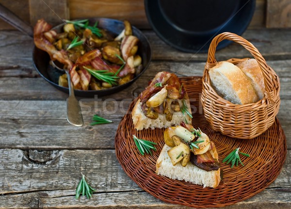 Fried cepes with bacon, garlic and rosemary Stock photo © zoryanchik
