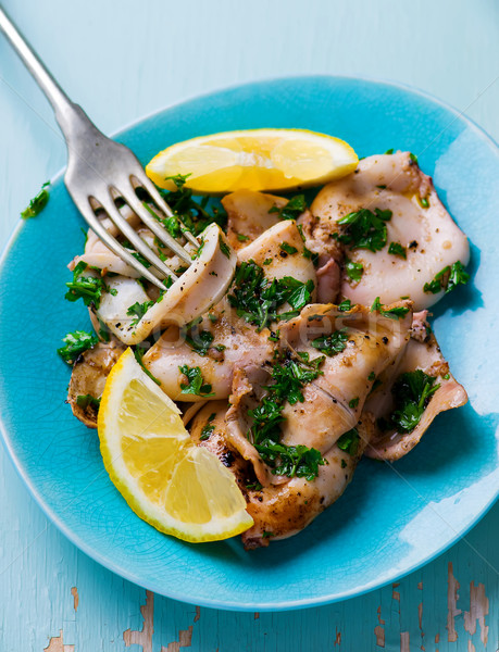 grilled calamary a grill with parsley and a lemon Stock photo © zoryanchik