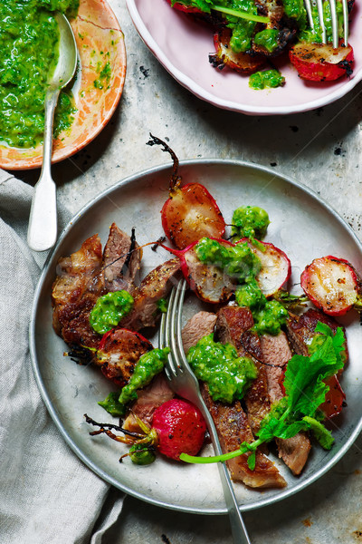 Stock photo: RIB-EYE STEAKS WITH RADISH GREENS CHIMICHURRI SAUCE.style rustic.